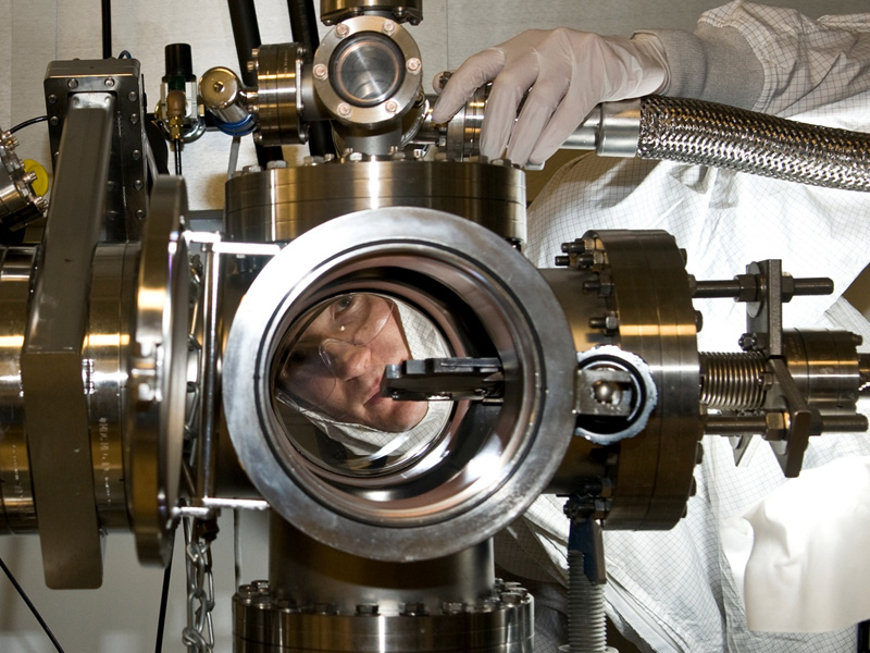 Student Inspecting Lab Equipment
