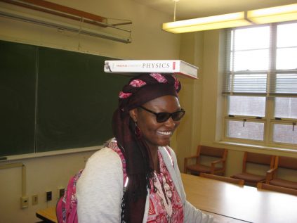 Abolaji Akinyemi balancing a book on her head