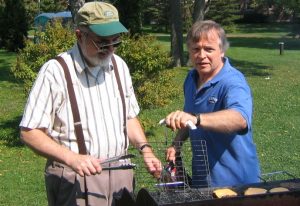 David Batuski and C. Thomas Hess at a grill